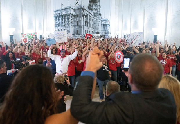 Striking teachers celebrate as lawmakers reject a bill that would have opened the first charter schools in the state, in Charleston 
