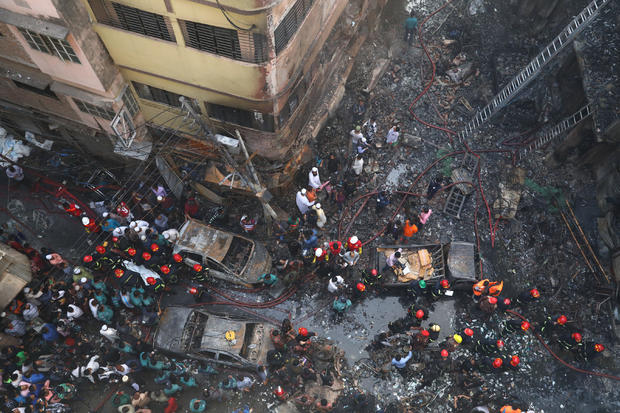 General view outside the burnt warehouse at Chawkbazar in Dhaka 