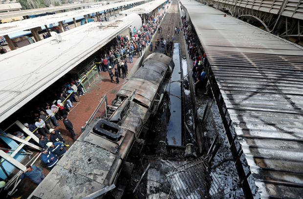 Damaged train is seen at the main train station after a fire caused deaths and injuries, in Cairo 