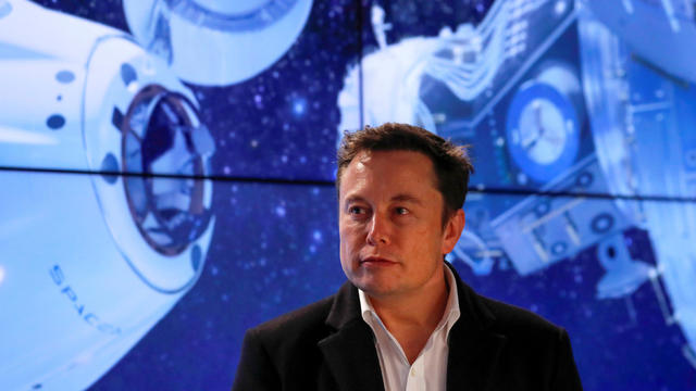 Musk looks on at SpaceX Falcon 9 post-launch news conference in Cape Canaveral 
