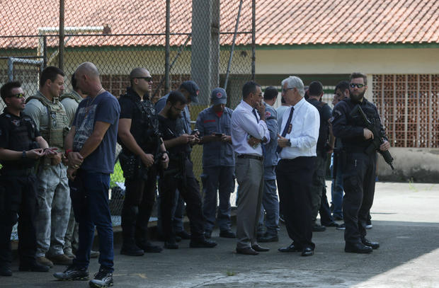 Policemen are seen at the Raul Brasil school after a shooting in Suzano 