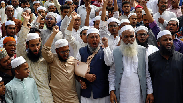 Muslims shout slogans as they condemn the Christchurch mosque attack in New Zealand, after Friday prayers at the Baitul Mukarram National Mosque in Dhaka 