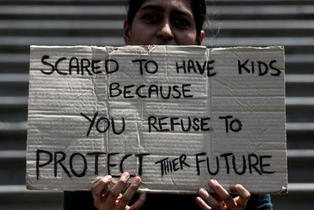 A student takes part in a global protest against climate change in Mumbai 