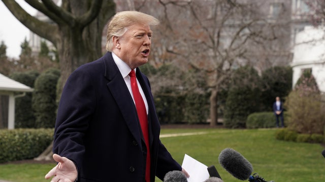 U.S. President Trump talks to reporters as he departs on travel to Ohio from the White House in Washington 