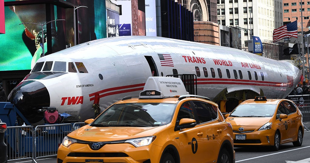Vintage TWA Plane Lands In Times Square Before An Airport Bar