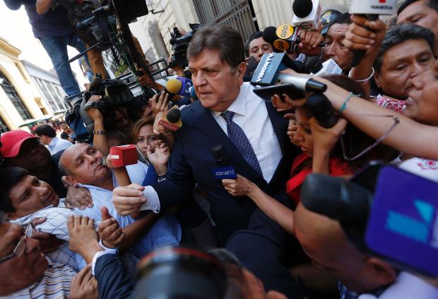 Former Peruvian President Alan Garcia talks to the media after testifying on the Brazilian construction giant Odebrecht bribes case in Lima on Feb. 16, 2017. 