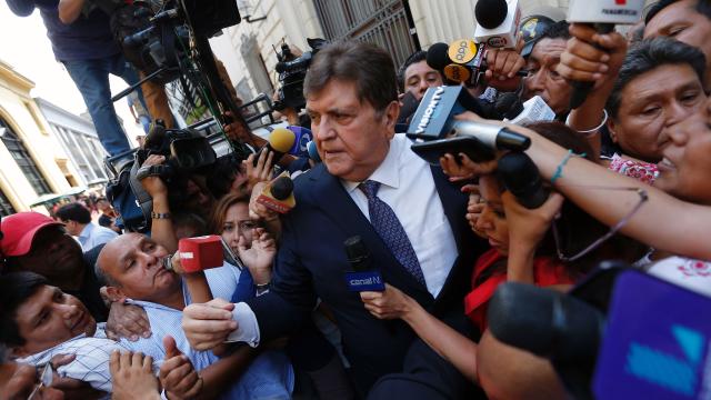 Former Peruvian President Alan Garcia talks to the media after testifying on the Brazilian construction giant Odebrecht bribes case in Lima on Feb. 16, 2017. 