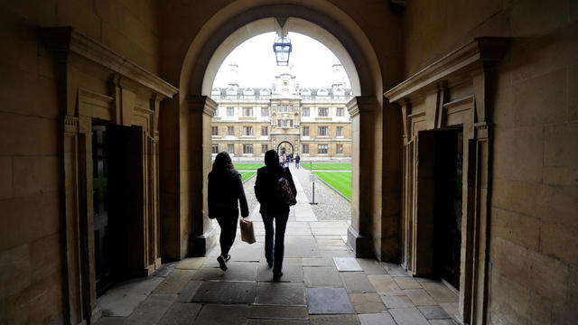 FILE PHOTO: People walk into the quadrant of Clare College at Cambridge University in eastern England 