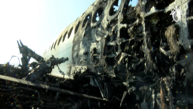 A still image shows a burnt-out Aeroflot Sukhoi Superjet 100 passenger plane at Moscow's Sheremetyevo airport 