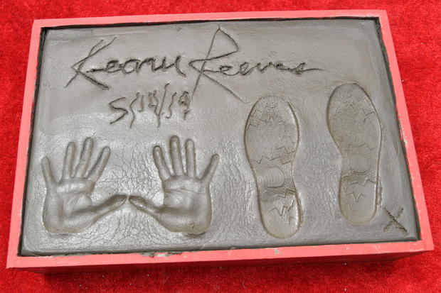 Keanu Reeves Places His Hand Prints In Cement At TCL Chinese Theatre IMAX Forecourt 