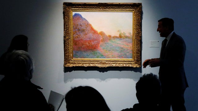 Monet painting part of "Les Meules" is displayed at Sotheby's during a press preview of their upcoming impressionist and modern art sale in New York 