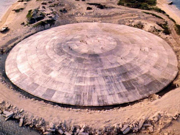 A picture taken by the U.S. Defense Nuclear Agency in 1980 shows a huge dome that had just been completed over the top of a crater left by one of the 43 nuclear blasts on Runit island, part of Enewetak atoll, in the Marshall Islands. 