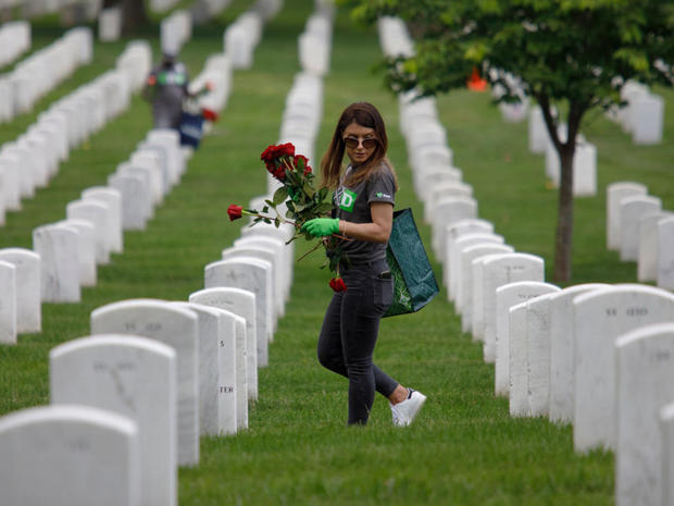 Volunteers Place Flowers On Gravesites At Arlington National Cemetery Ahead Of Memorial Day 