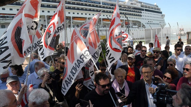 Members of "No grandi navi - No big ships" movement protest in front of the MSC Opera cruise ship that early in the morning crashed against a smaller tourist boat at the San Basilio dock in Venice 