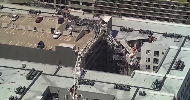 Crane slices through Dallas apartment building killing one person CBS