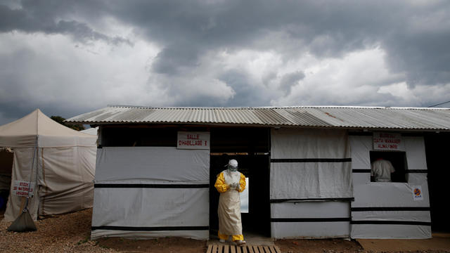 FILE PHOTO: A health worker wearing Ebola protection gear, leaves the dressing room before entering the Biosecure Emergency Care Unit at the ALIMA Ebola treatment centre in Beni 