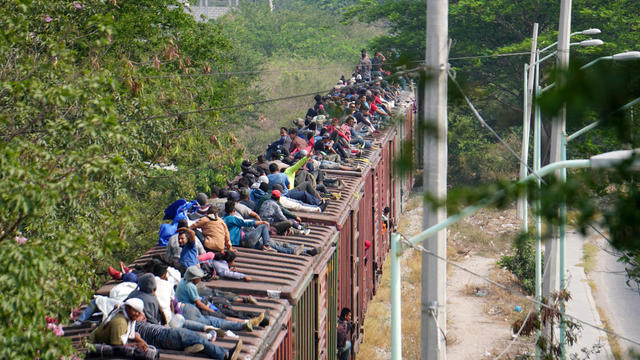 FILE PHOTO: Central American migrants ride train through Juchitan, Oaxaca 