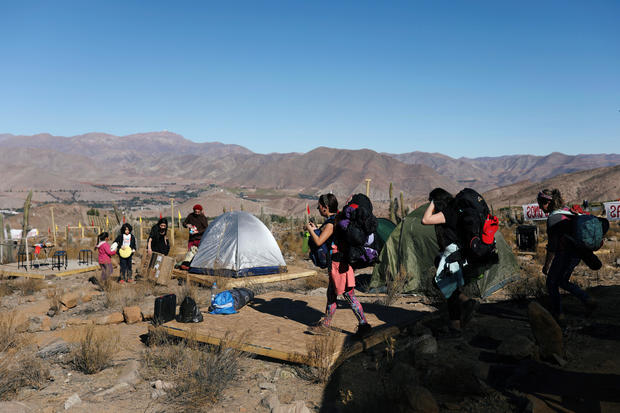 Tourists arrive at a campsite before a total solar eclipse to take place on July 2, at the Mamalluca Observatory, in Valle del Elqui 