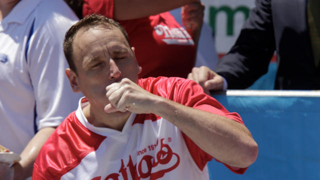 Joey Chestnut eats during the Nathan's Famous Fourth of July hot dog eating contest on July 4, 2019, in New York City. 