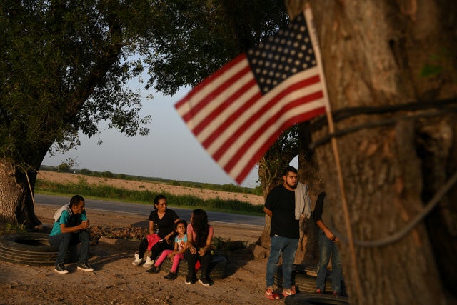Central American asylum seekers turn themselves in to U.S. Border Patrol after illegally crossing the Rio Grande in Los Ebanos