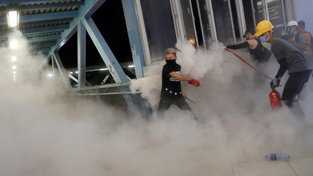 Demonstrators march to protest against the Yuen Long attacks in Yuen Long 