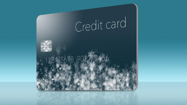 Frost covered credit cards illustrate putting a credit freeze on a credit report. 
