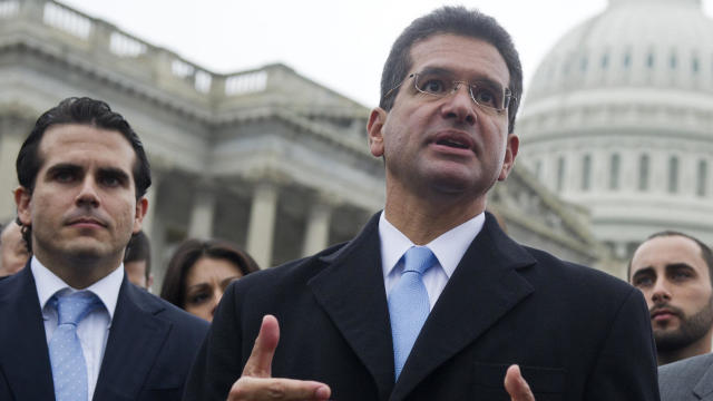 Resident Commissioner Pedro Pierluisi, center, of Puerto Rico speaks alongside Puerto Rican activists, urging Congress to allow an end to the island's territorial status during a press conference at the U.S. Capitol in Washington on Jan. 15, 2013. 