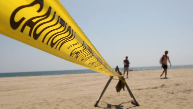 Caution tape on a beach 