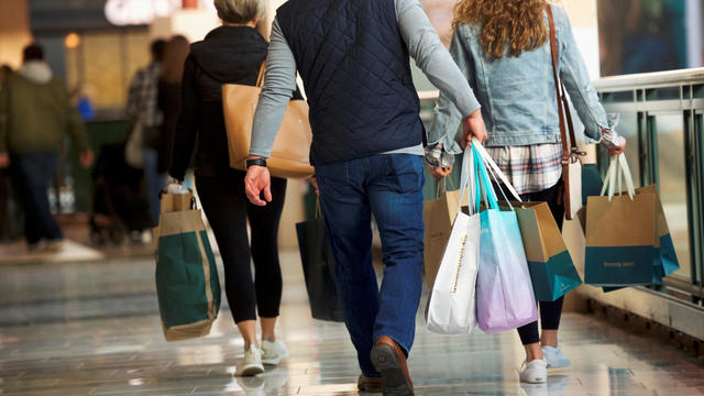 FILE PHOTO: Shoppers carry bags of purchased merchandise at the King of Prussia Mall in King of Prussia 