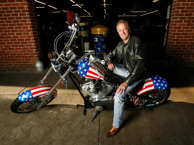 FILE PHOTO: Fonda poses for a portrait on a replica of the "Captain America" bike in Glendale 