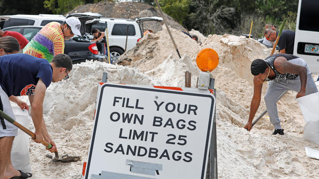 Local residents fill sandbags ahead of the arrival of Hurricane Dorian in Kissimmee 