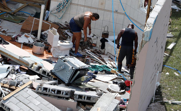 Residents look through debris after hurricane Dorian hit the Grand Bahama Island in the Bahamas 