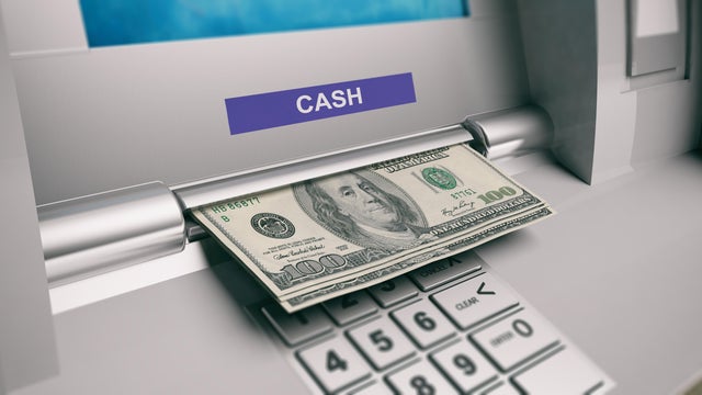 Dollars out of a ATM machine. 3d illustration 