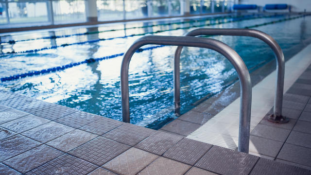 Swimming pool with hand rails 