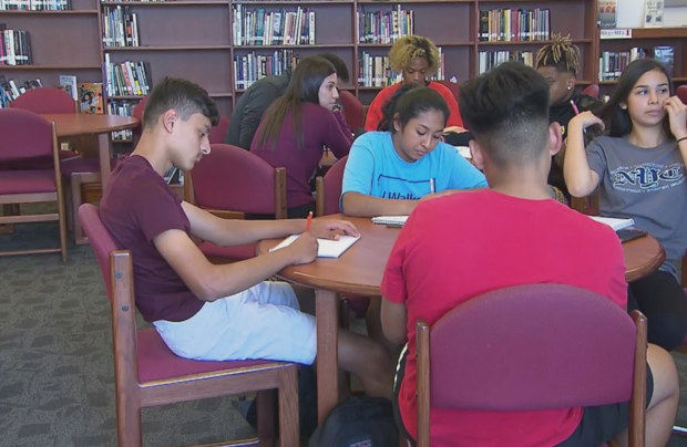Students at Hillcrest High School in Dallas register to vote 