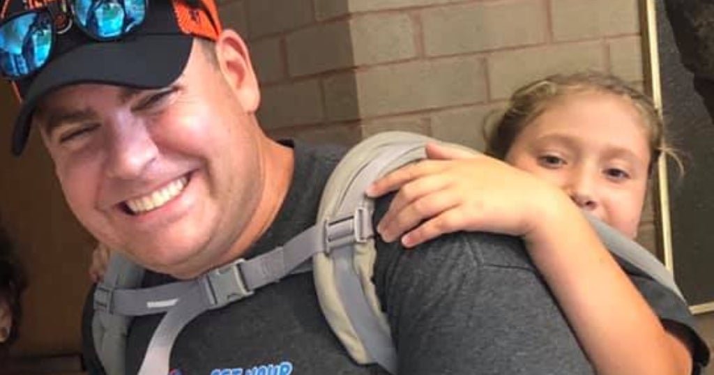 Teacher Carries Wheelchair Bound Student Through Rugged Terrain On