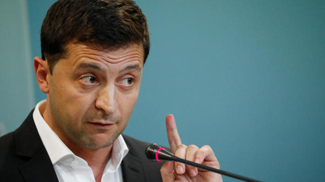 Ukrainian President Volodymyr Zelenskiy gestures during a news conference in Kiev 