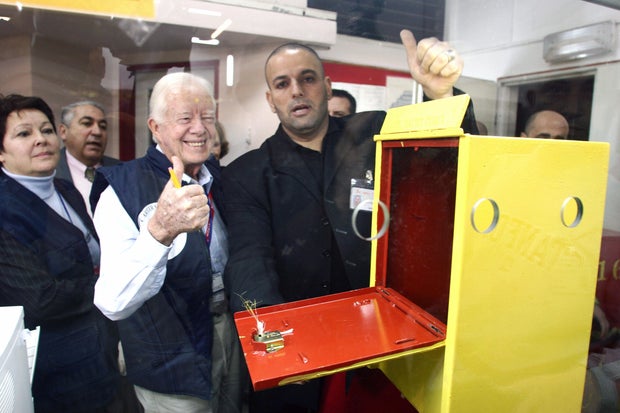 Former U.S. President Jimmy Carter (L) a