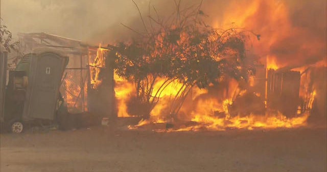 California wildfires rage, fueled by forceful wind gusts