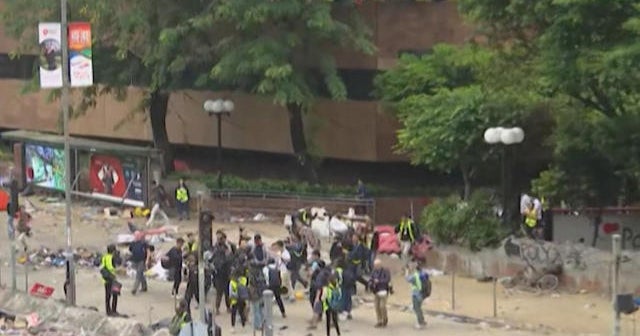 Protesters and police locked in tense standoff at Hong Kong university