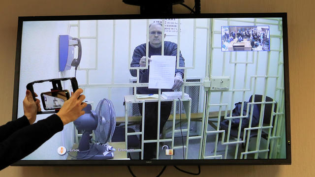 Former U.S. marine Whelan is seen on a screen via a video link during a court hearing in Moscow 