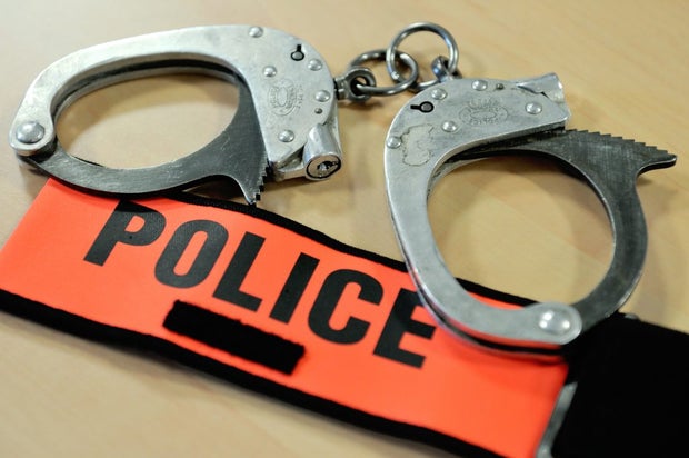 FRANCE-POLICE-HANDCUFFS-BADGE 