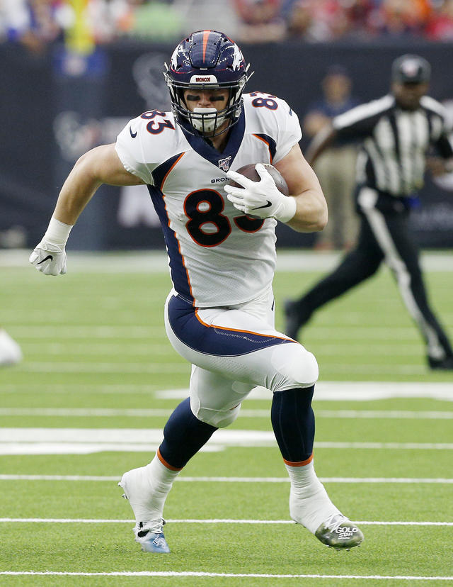 Denver Broncos tight end Andrew Beck (83) warms up before playing