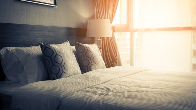 house beautiful design concept with soft cozy pillow on bed in bedroom 