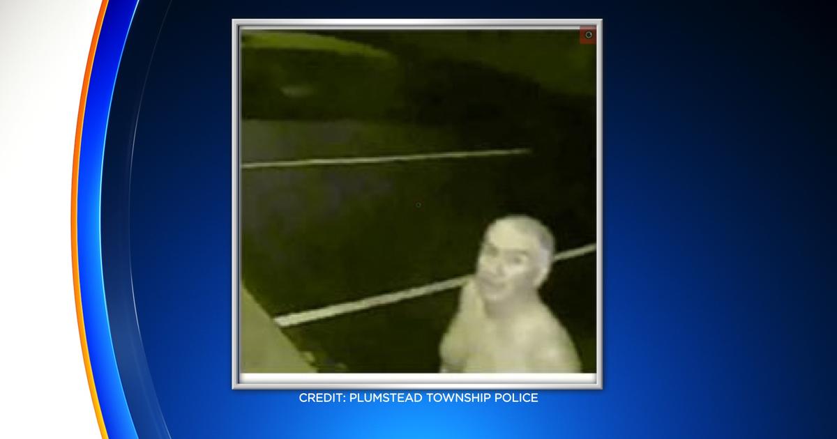 Police Surveillance Video Catches Naked Man Pulling On Doors Of