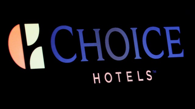 The company logo for Choice Hotels is displayed on a screen on the floor of the NYSE 