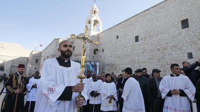 Members of a Palestinian scout band perform during Christmas celebrations at Manger Square in Bethlehem in the Israeli-occupied West Bank 