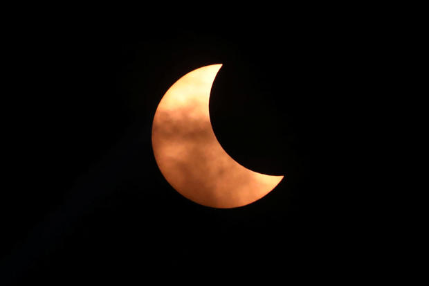 Partial solar eclipse occurs over the skies of Kuala Lumpur 
