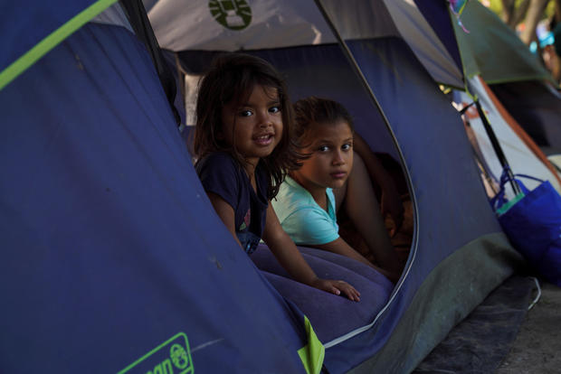 Asylum-seeking children pass their time in an encampment where they live in Matamoros 