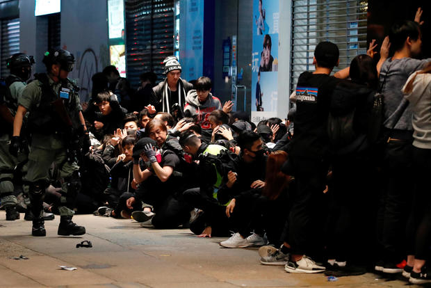 Riot police detain anti-government protesters during a demonstration on New Year's Day to call for better governance and democratic reforms in Hong Kong, China, January 1, 2020. 